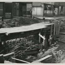 Laying telephone conduit at St. Clair and Norwood, 5 months after explosion